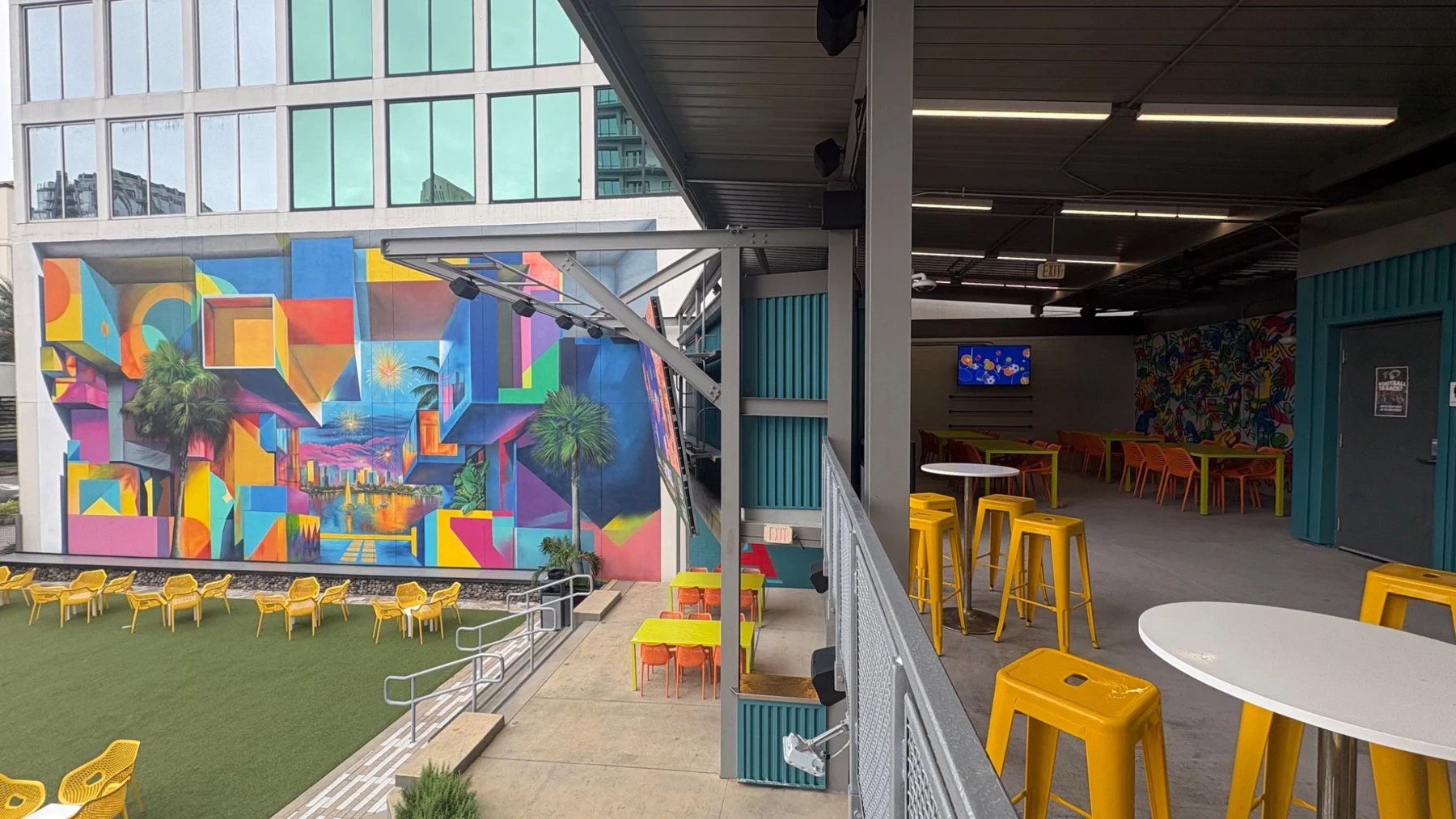 Murals and outdoor tables at À La Cart City District in Downtown Orlando